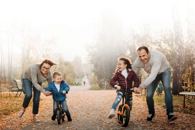 family with kids on bikes